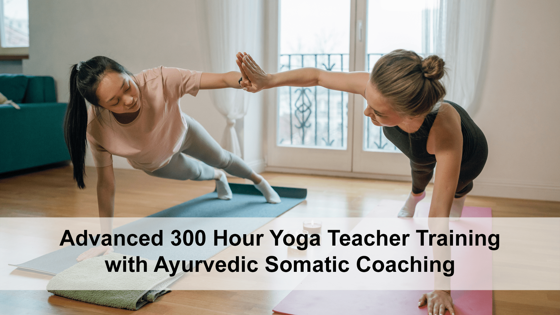 A Yoga Therapist high fiving a student in plank pose