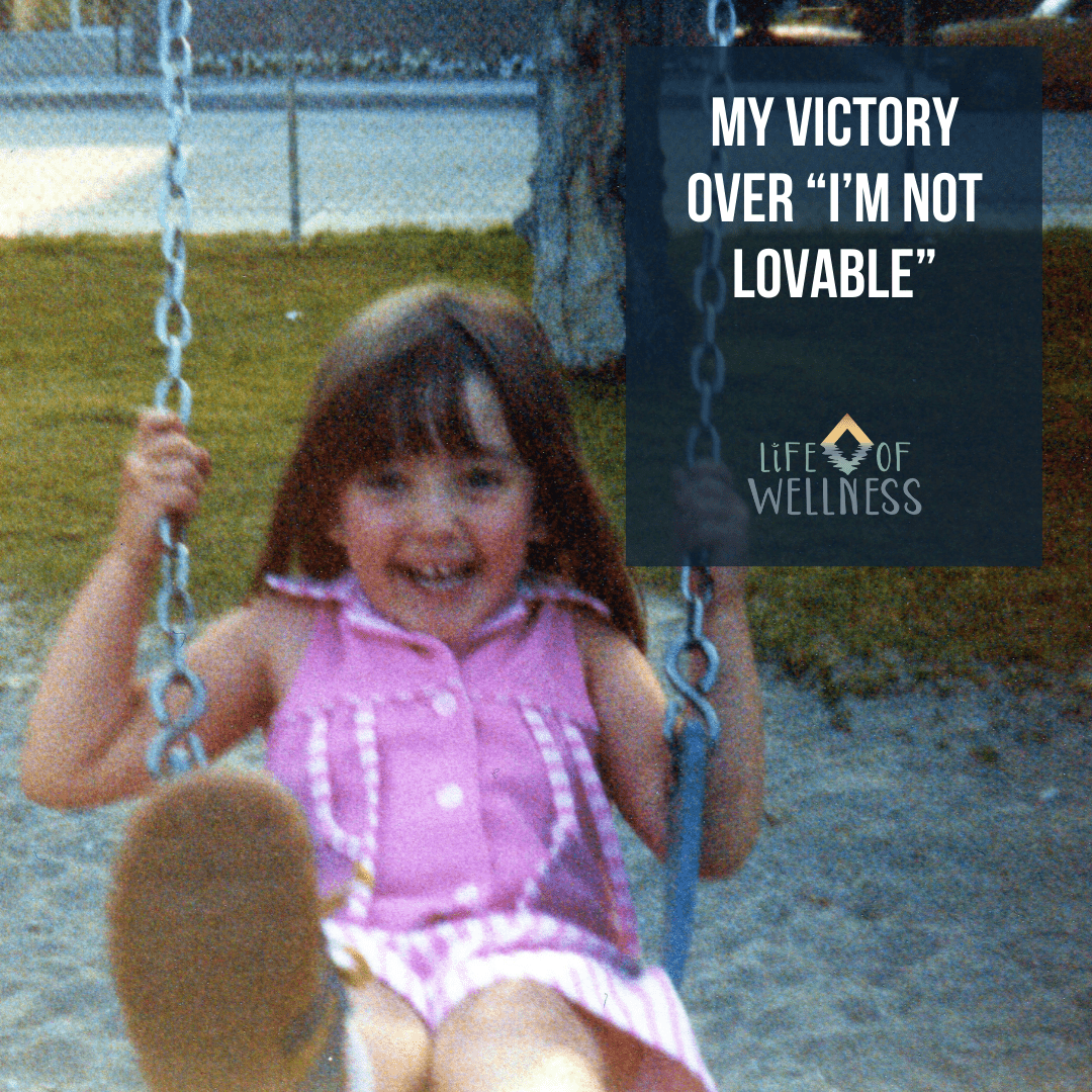 a picture of me as a young child smiling while swinging on a swing